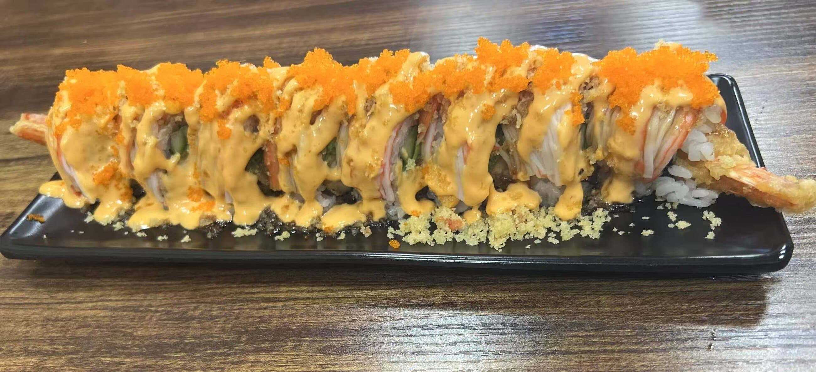 A long platter of made-to-order specialty sushi rolls