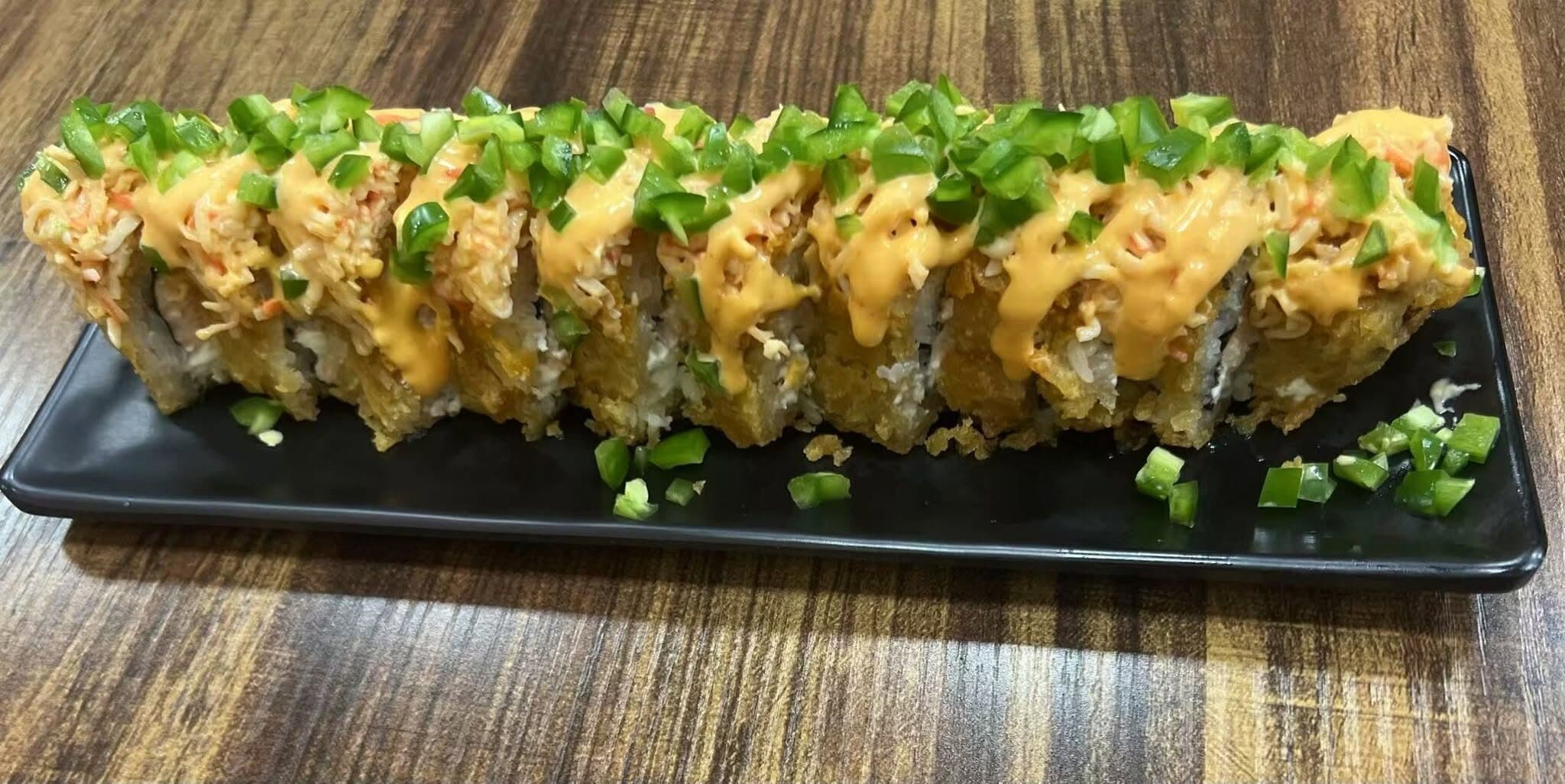 Crispy roll topped with fresh jalapeño and chipotle sauce